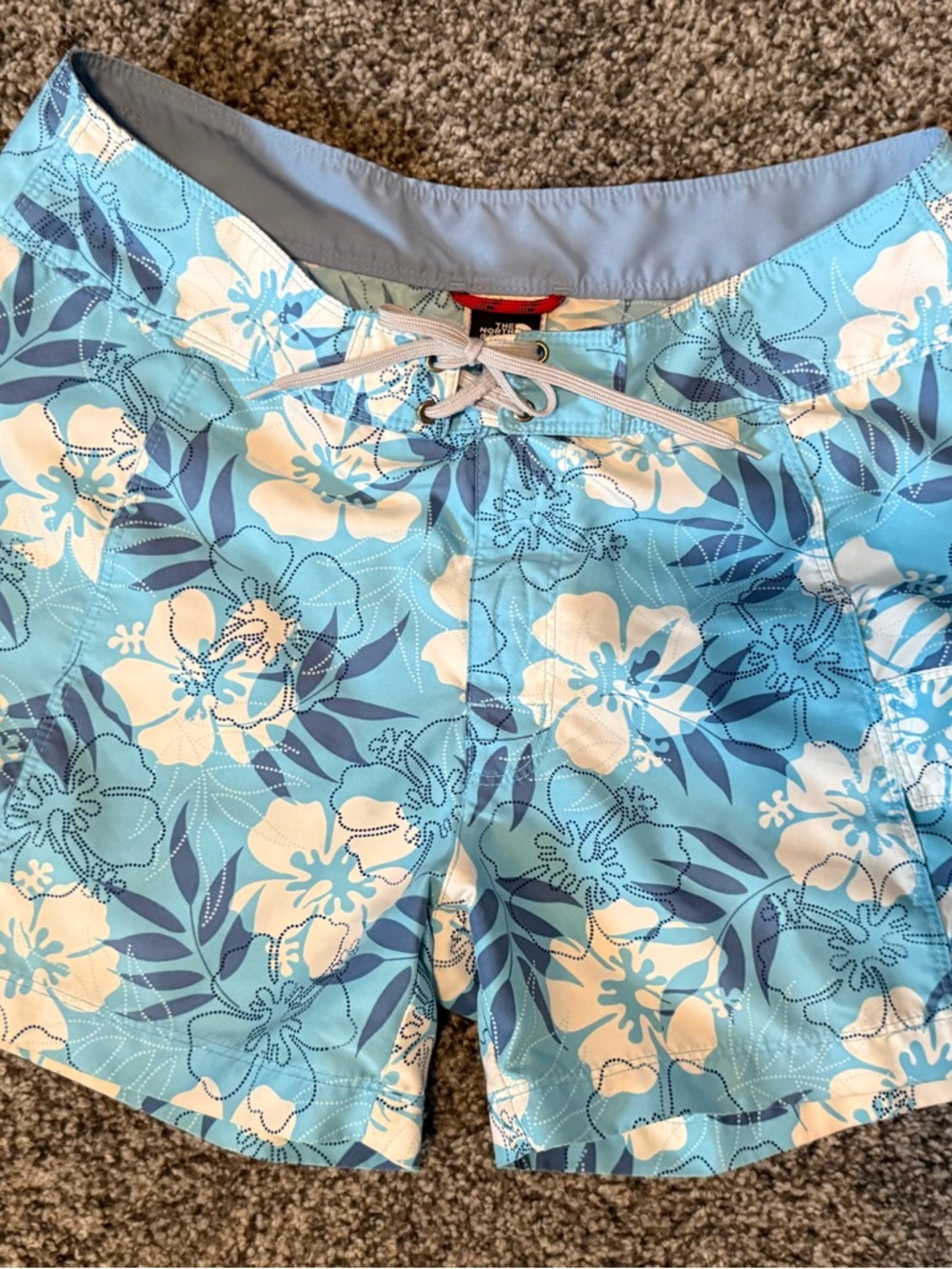 The North Face light blue floral board shorts